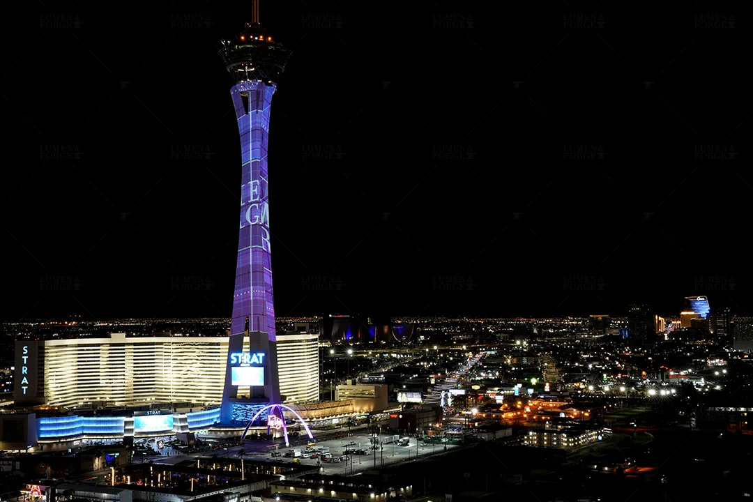 Purple projection spanning the full height of the Stratosphere above Las Vegas