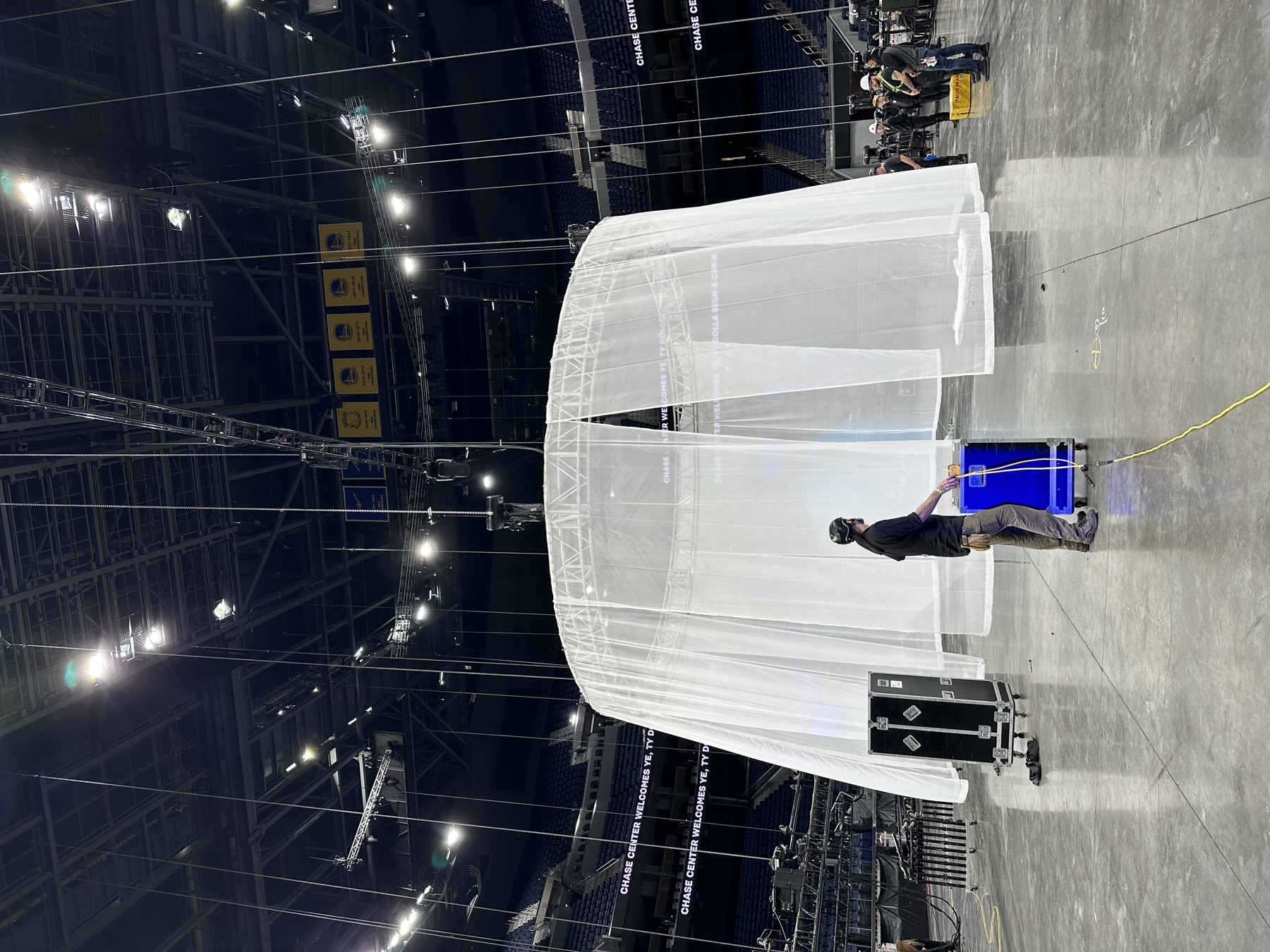 Behind-the-scenes workroom view of the circular scrim and arena rigging at Chase Center