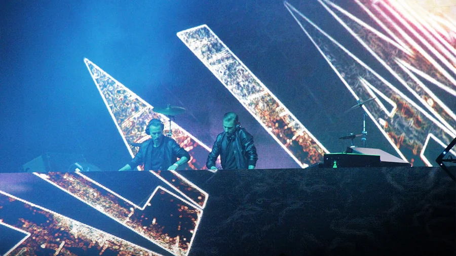 Decadence NYE stage with branded festival visuals and live crowd