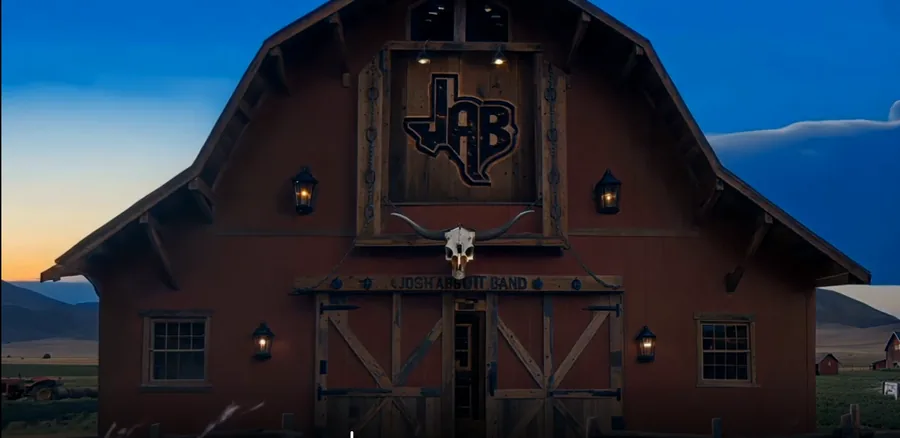 Josh Abbott Band barn exterior dusk visual with JAB logo and western facade