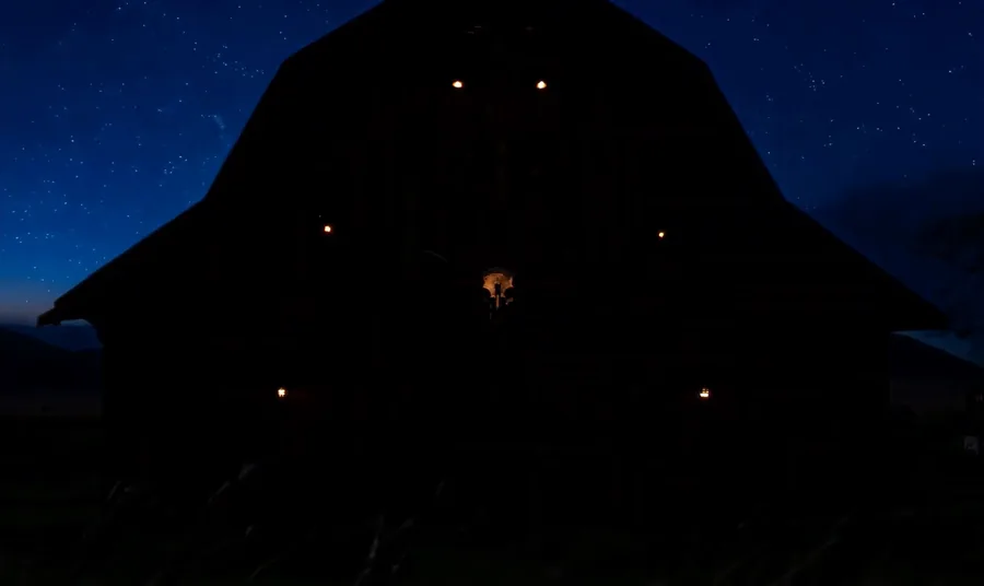 Josh Abbott Band barn exterior night silhouette under a starry blue sky