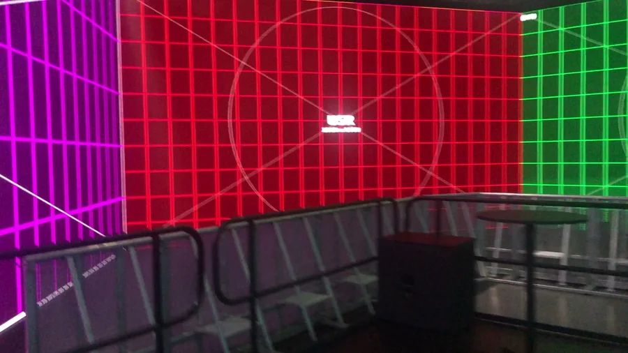 Red LED wall calibration grid and physical room barricade layout