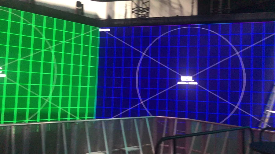 Green and blue LED wall calibration grids with curved alignment guides