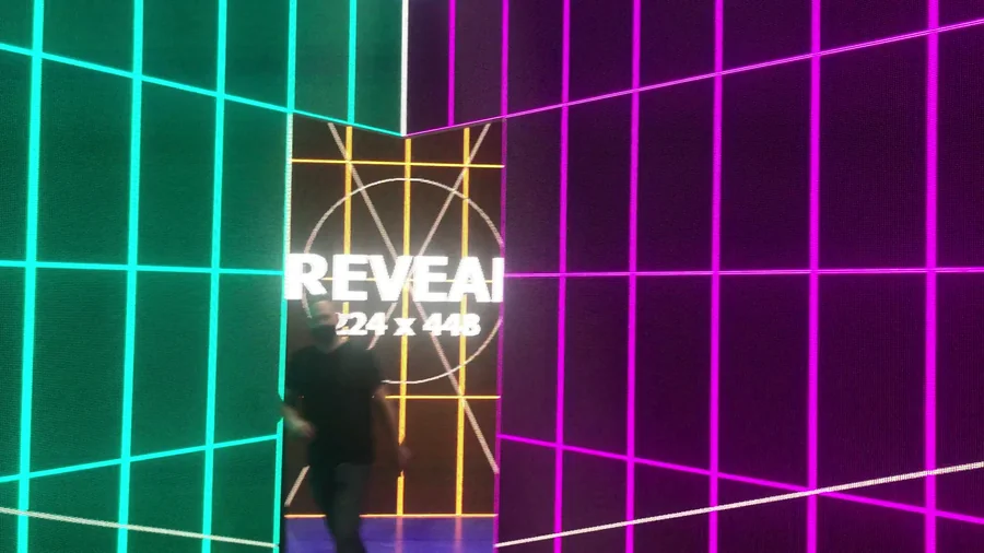 LED wall test with person standing in front of the center reveal panel