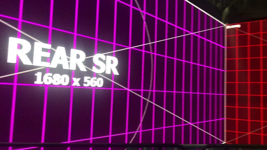 Magenta and red LED wall mapping test around a room corner