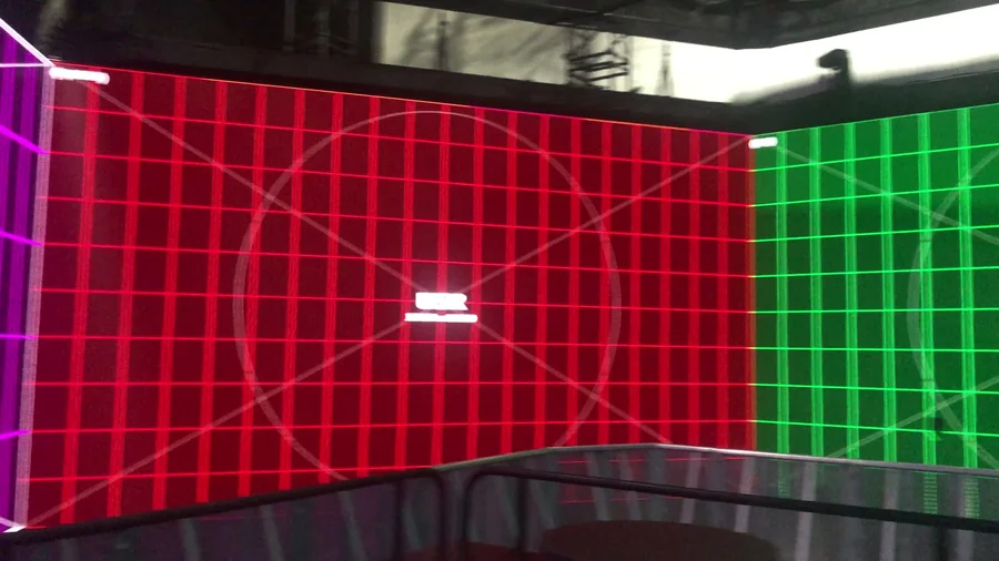 Red and green LED walls with calibration grid and reflective floor