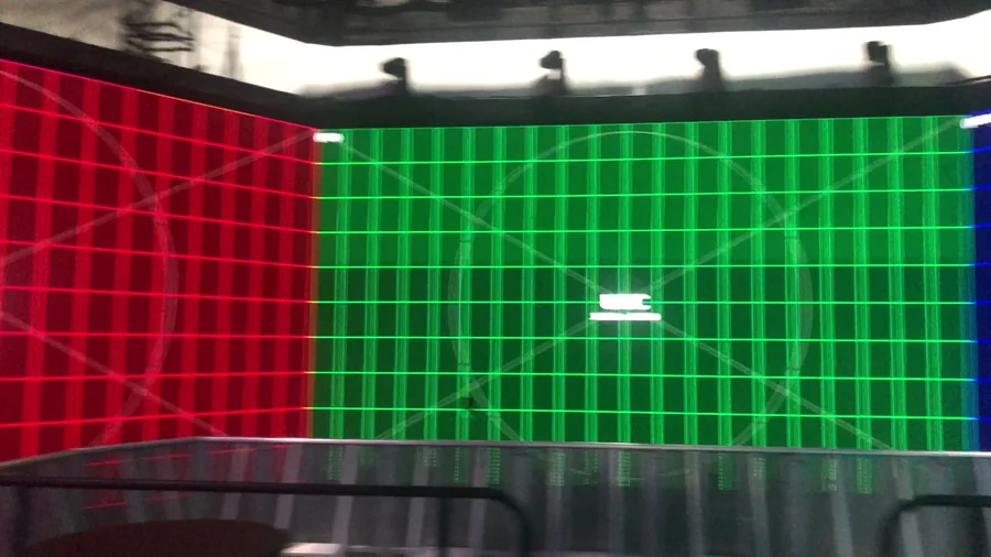 Green LED wall calibration grid filling the physical pentagon space