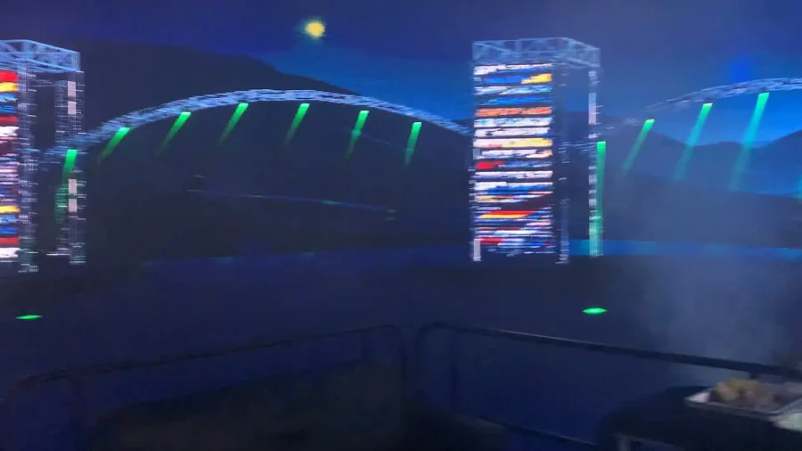Oblique view of the animated virtual stage with LED columns and arched truss