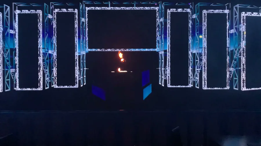 Dark front view of the virtual stage showing the pentagon LED structure outline
