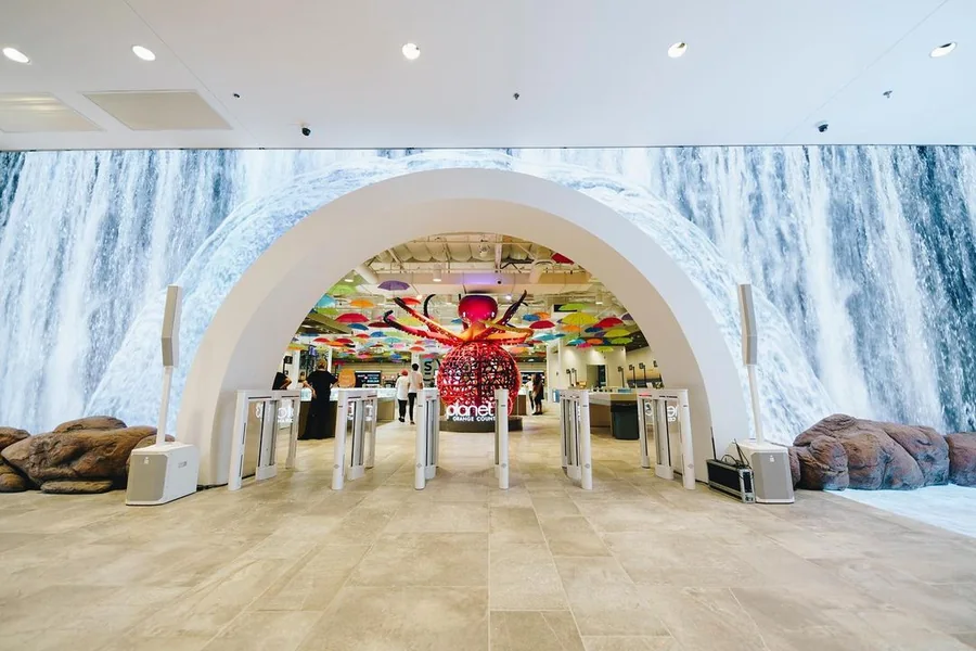 Planet 13 Orange County waterfall LED wall wrapping the entry portal