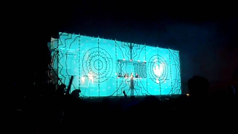 Blue circular projection content on the Tower of Babel facade