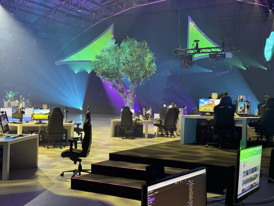 Riot Games competition set with the fabricated tree illuminated by mapped content beneath broadcast cameras