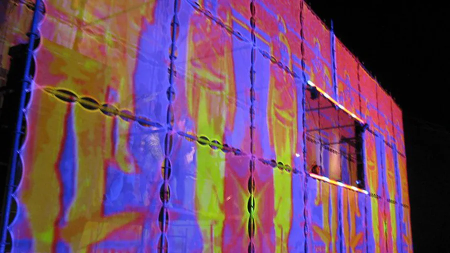 Colorful mapped video content across the Tower of Babel side wall