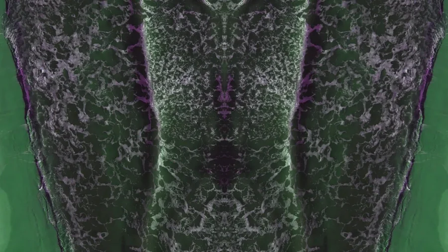 Green and violet mirrored wave still from the first water movie deliverable