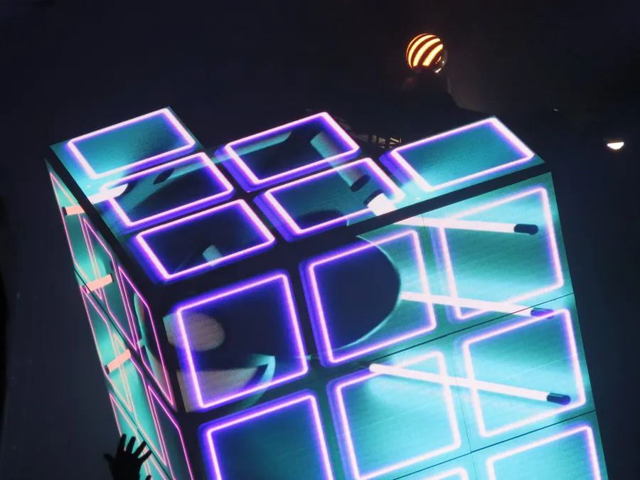 Segmented Cube 2.1 surfaces outlined with cyan and violet light