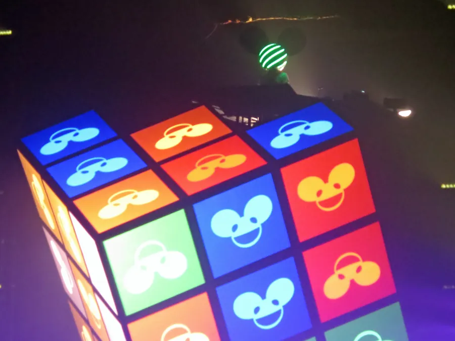 Colorful icon grid wrapping the top and front surfaces of Cube 2.1