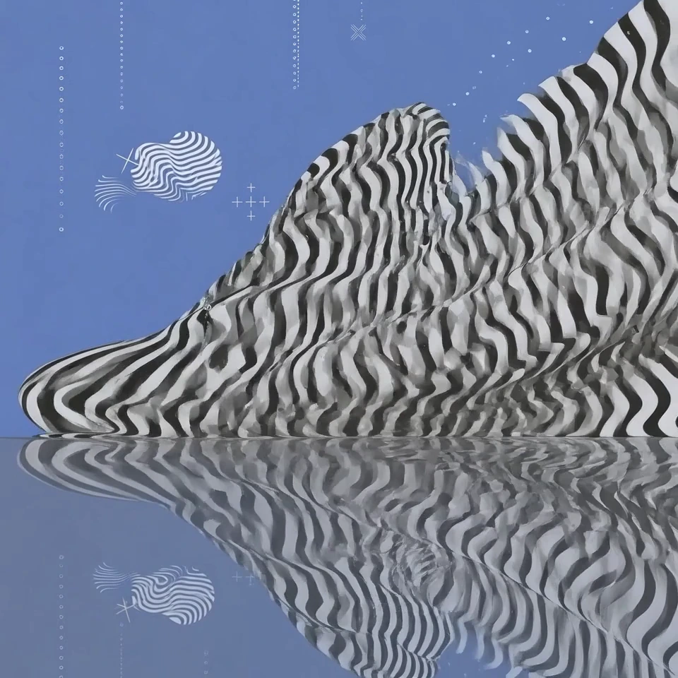 A striped wave sculpture and its reflection against a blue sky.
